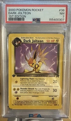 2000 PSA 7 Near Mint Dark Jolteon 38/82 TCG Team Rocket 1st Edition English