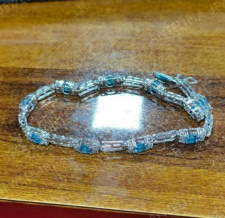 Brazalete Tenis 6 Ct Corte Redondo Topacio Azul Londres y Diamante Acabado Oro Blanco 14k Foto 4 de 4