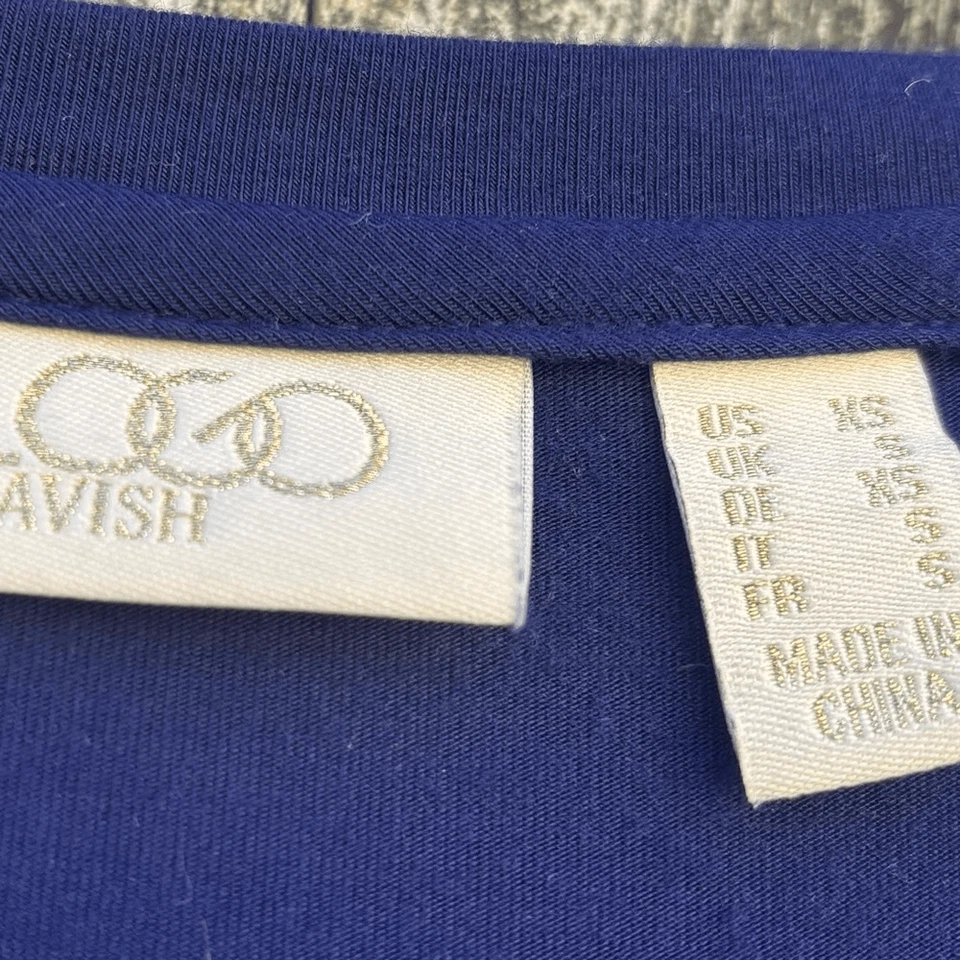 Top túnica de encaje floral dorado lujoso con logotipo XS Foto 2 de 4