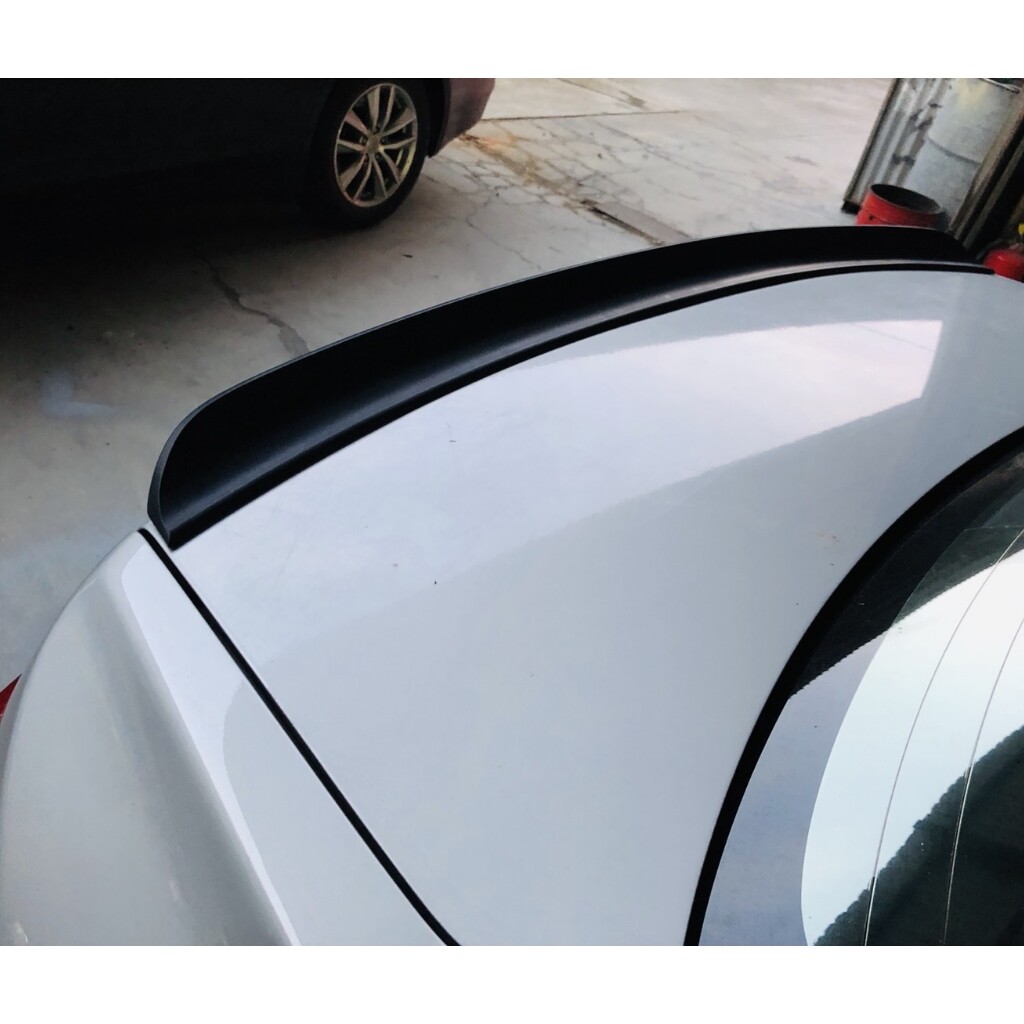 SpoilerKing Duckbill Lip Spoiler For Mitsubishi Lancer 2002-2007 - Unpainted Matte Black, No Drilling