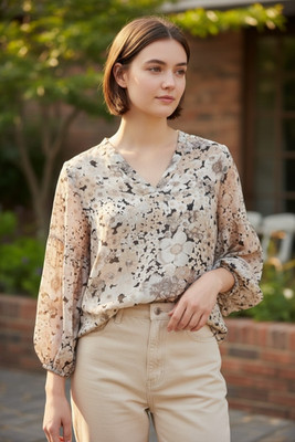 Joie sheer floral tunic in muted earthy shades with balloon sleeves.