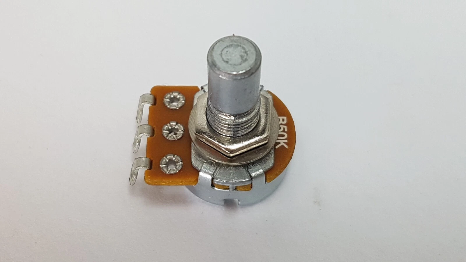 Alpha B50K potentiometer side view: threaded bushing, hex nut, round shaft