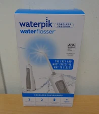 Waterpik Portable Cordless Freedom Water Flosser, tips, travel bag, batteries