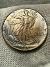 1945 50C Walking Liberty Half Dollar in Choice AU/UNC++ Condition Original Toned