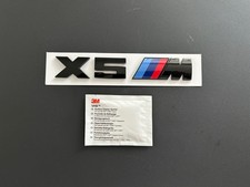 BMW X5M BADGE  IN GLOSS BLACK. FREE ALCOHOL WIPE