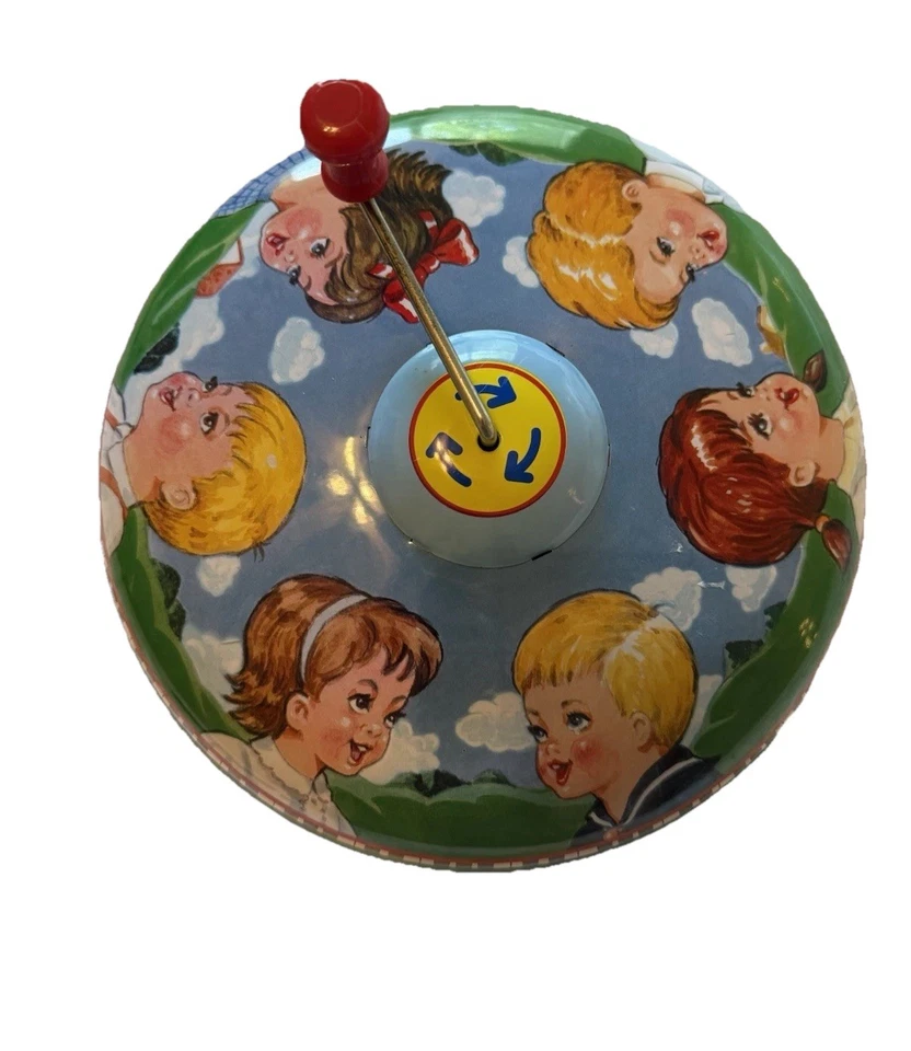 Tapa musical de hojalata Schylling juguete giratorio vintage manivela de metal coleccionable para niños Foto 2 de 4