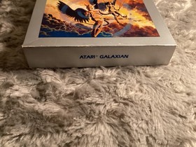 Mint condition cartridge of Galaxian Atari 5200 1981 complete with overlays