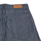 Blue Etienne Marcel skinny crop jeans with back pocket, brown leather patch on waistband, and red, white, and blue flag on hem.