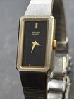 Vintage Seiko Two-Tone Gold + Silver and Black Quartz Watch 1320