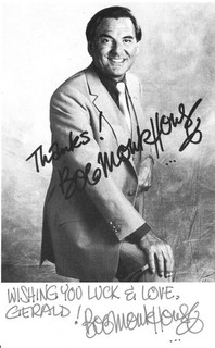 BOB MONKHOUSE (THE GOLDEN SHOT FAMILY FORTUNES) GENUINE HAND SIGNED B/W PHOTO.