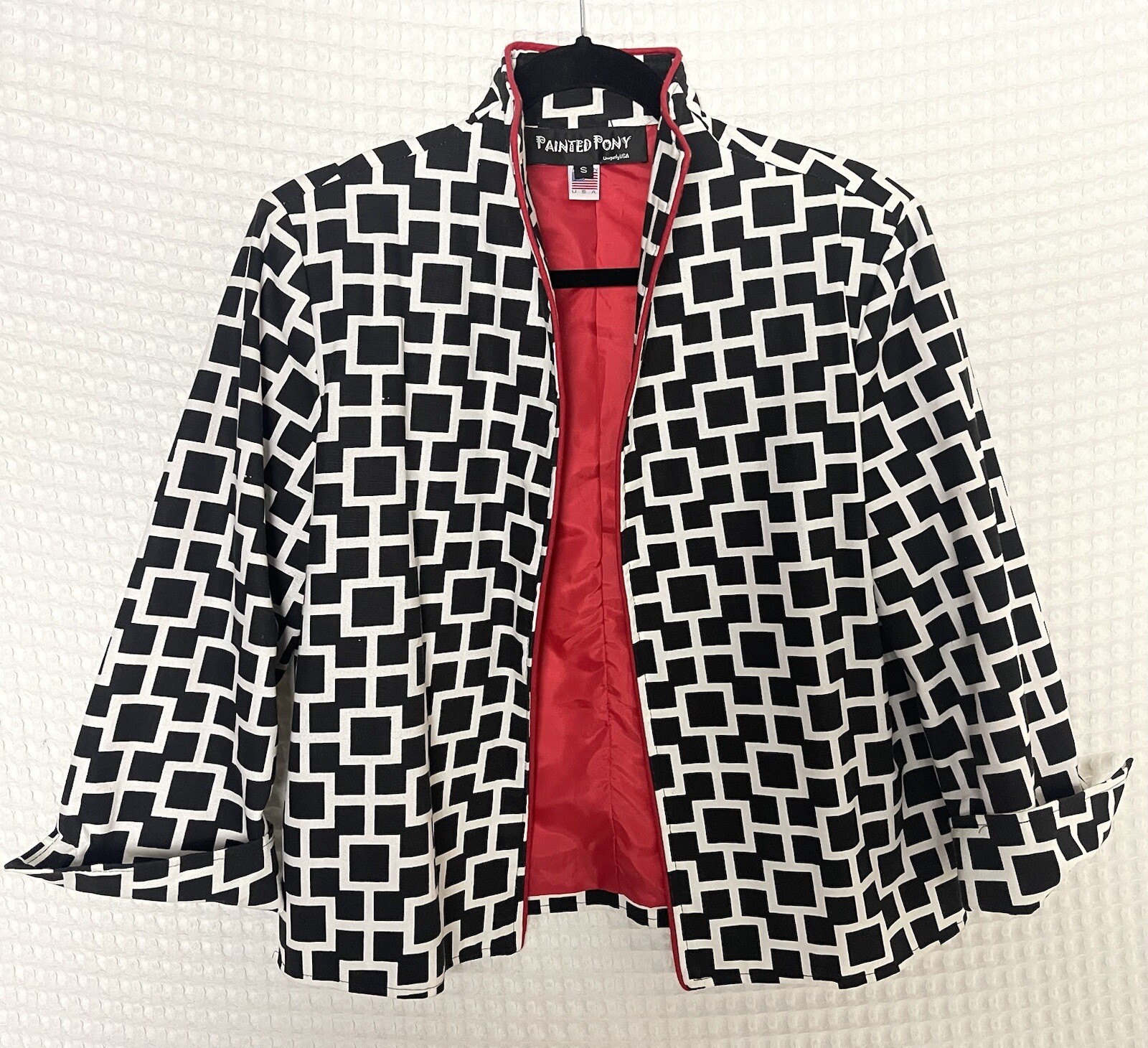 Giacca anteriore aperta pony dipinta donna nero bianco con fodera rossa taglia small