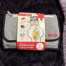 Skip Hop Pronto signature Portable charging Station 2-in-1 diaper clutch.