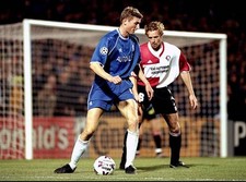 Tore Andre Flo of Chelsea is watched by Bert Konterman of Feyenoor- Old Photo