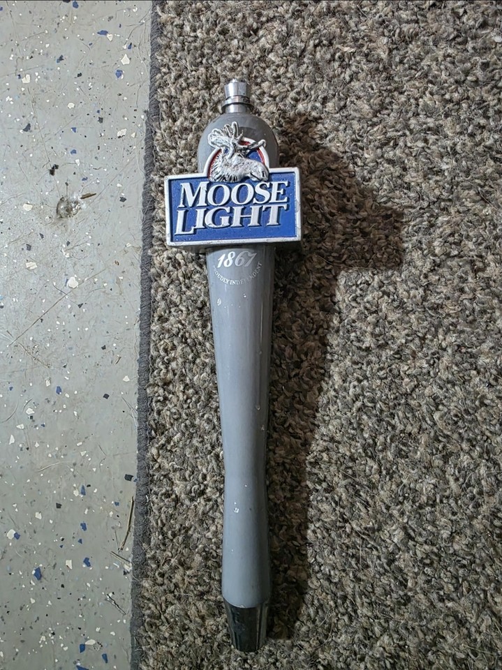 A carved wooden moose head beer tap handle that turns any home draft setup into a hunting lodge trophy bar.
