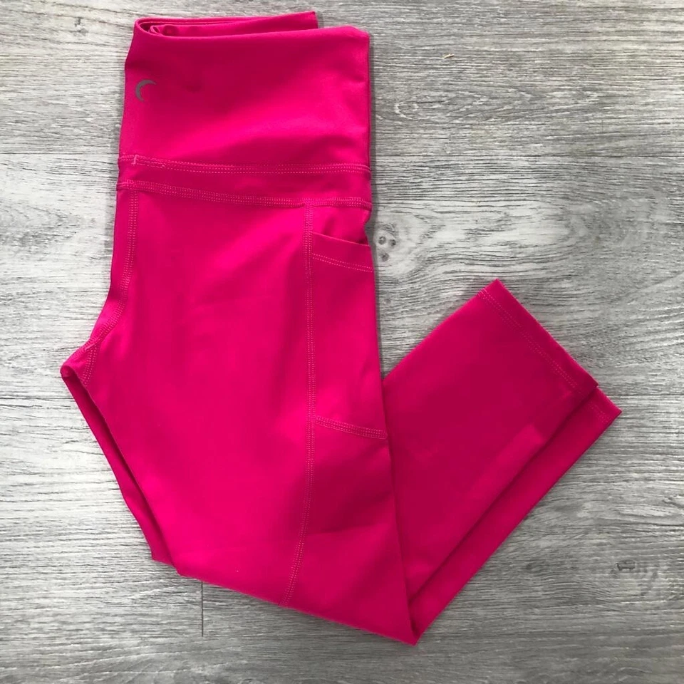 Legging capri ZYIA Active para mujer 4 fiestas rosa claro N ajustado tiro medio bolsillo Foto 2 de 4