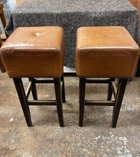 Pair of square tan leather bar stools