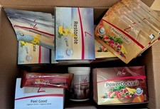 Box mit fitline PowerCocktail, Restorate, Proshape Aminos …