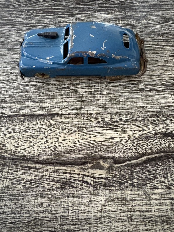 Tin Friction car with gun on the hood Made in Japan