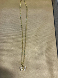Authentic HQ Gold plated Chain Necklace, White Crystal Bow Pendant, Lobster Clasp