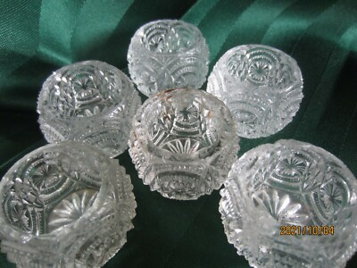 Seven vintage pressed glass salt cellars
