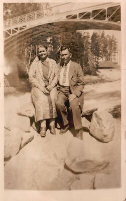 Vintage Postcard 1900's Husband and Wife Sitting on Big Stone Under the Bridge