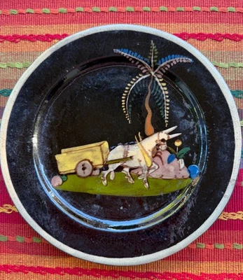 Vintage Mexican Tlaquepaque black plate ox and cart 7 3/8" diam. - Image 1 of 3