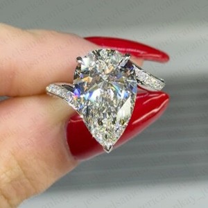 Authentic 3.98 TCW Pear Cut VVS1 Moissanite Bypass Engagement Ring 14K White Gold Plated