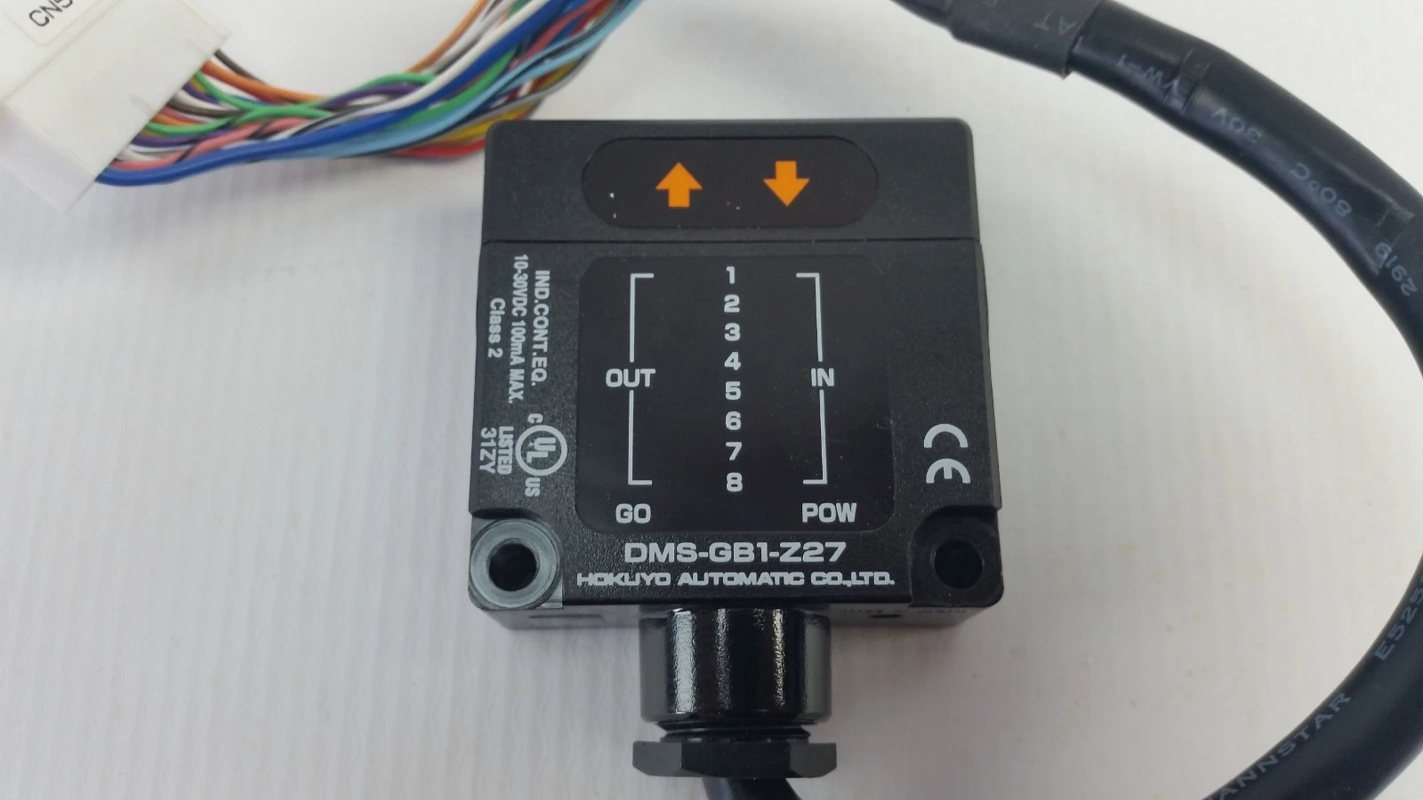 Front label of the Hokuyo DMS-GB1-Z27 showing IN and OUT 1–8, GO and POW indicators