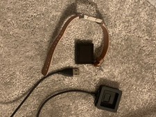 Black fitbit blaze with rose gold strap, char...