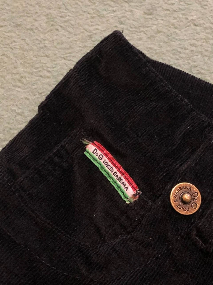 Pantalones de pana negros acampanados Dolce & Gabbana para mujer desgastados descoloridos estrellados años 90 Foto 2 de 4