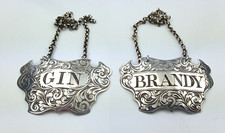PAIR VICTORIAN GEORGE UNITE ENGRAVED SILVER GIN & BRANDY DECANTER LABELS HM 1843