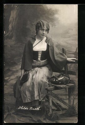Folding postcard actress Hilde Knoth sitting on a wooden bench 