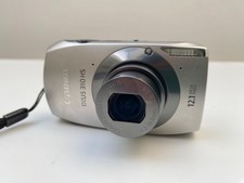 Canon IXUS 310 HS 12.1MP Silver Compact Digital Camera + New Battery Charger