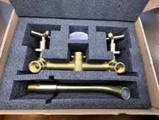 Modern 360 Swivel Brass Color Wall Faucet with Brass Construction and Handles