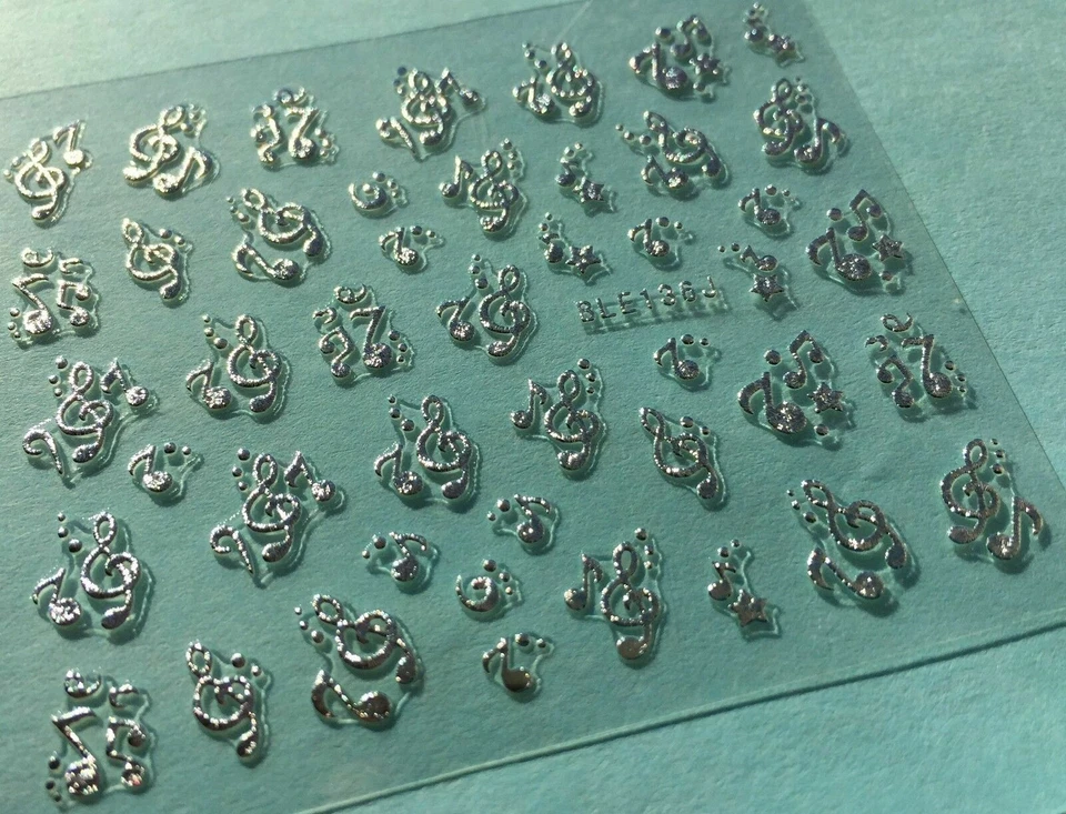 Calcomanía adhesiva 3D arte en uñas notas musicales metálicas plateadas BLE136J Foto 2 de 4