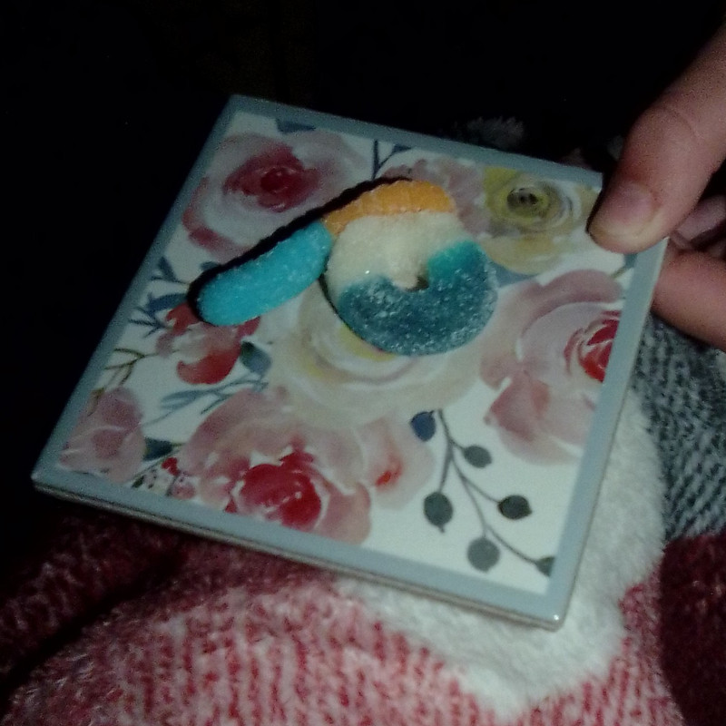 Bluerazeberry Ring With Gummy Worm Attached To It In Package