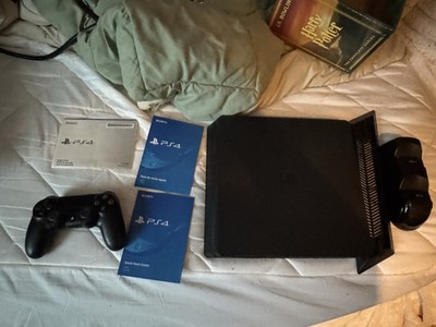 PlayStation 4 Slim with 1TB HDD, 1 controller, cables, and extra stuff