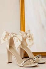 Oleg Cassini Ivory Satin Strappy High Heel Bridal Shoes with Bow and Rhinestones