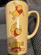 DISNEY STORE " WINNIE THE POOH " TEA / COFFEE MUG  15cms Tall 