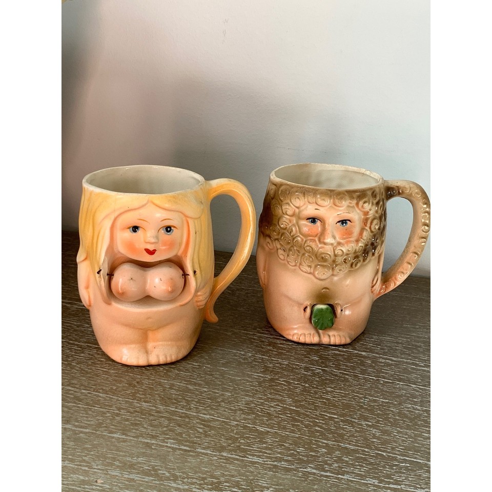 A matched set of ceramic Adam & Eve novelty mugs from Japan — risqué retro barware that's equal parts gag gift and genuine collectible.