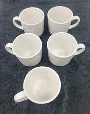 Set of  5 GIBSON HOUSEWARES White Mugs In A Raised Floral & Fruit Pattern 8 oz.