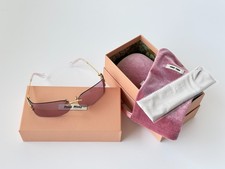 Miu Miu SMU A51 Wrap Sunglasses Purple Lens Pale Gold Frame Women