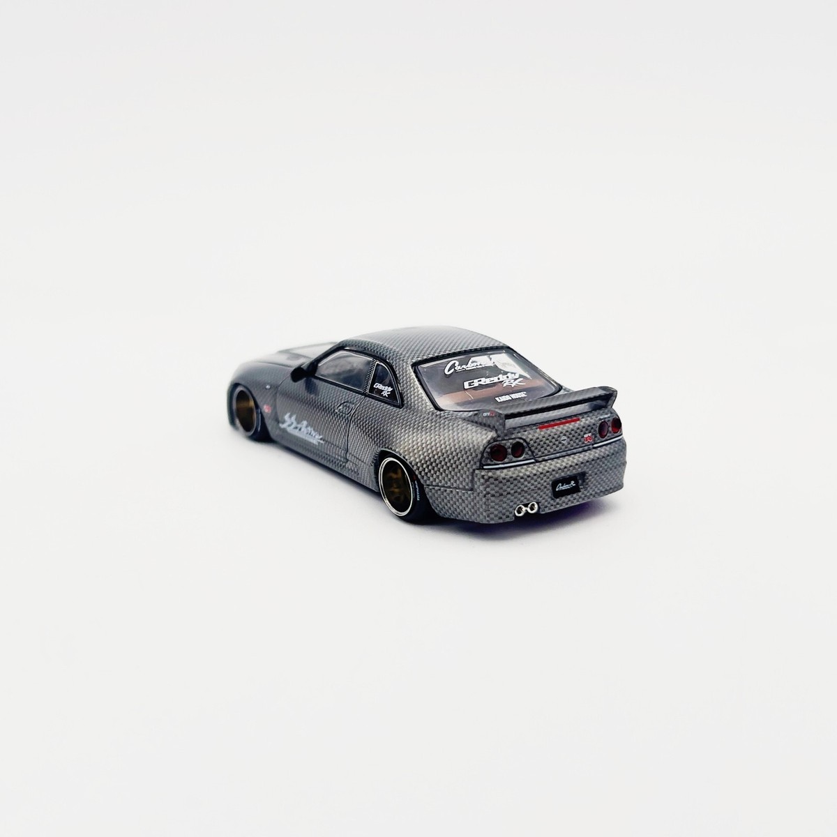 Modellino Nissan GT-R R33 In Carbonio Attivo 1/64 - Kaido House X