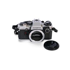 Olympus OM10 Chrome 35mm Film SLR c/w Manual Adapter  Straps. S/N: 1947380