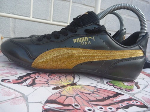 BLACK GOLD LEATHER TRAINERS LADIES 