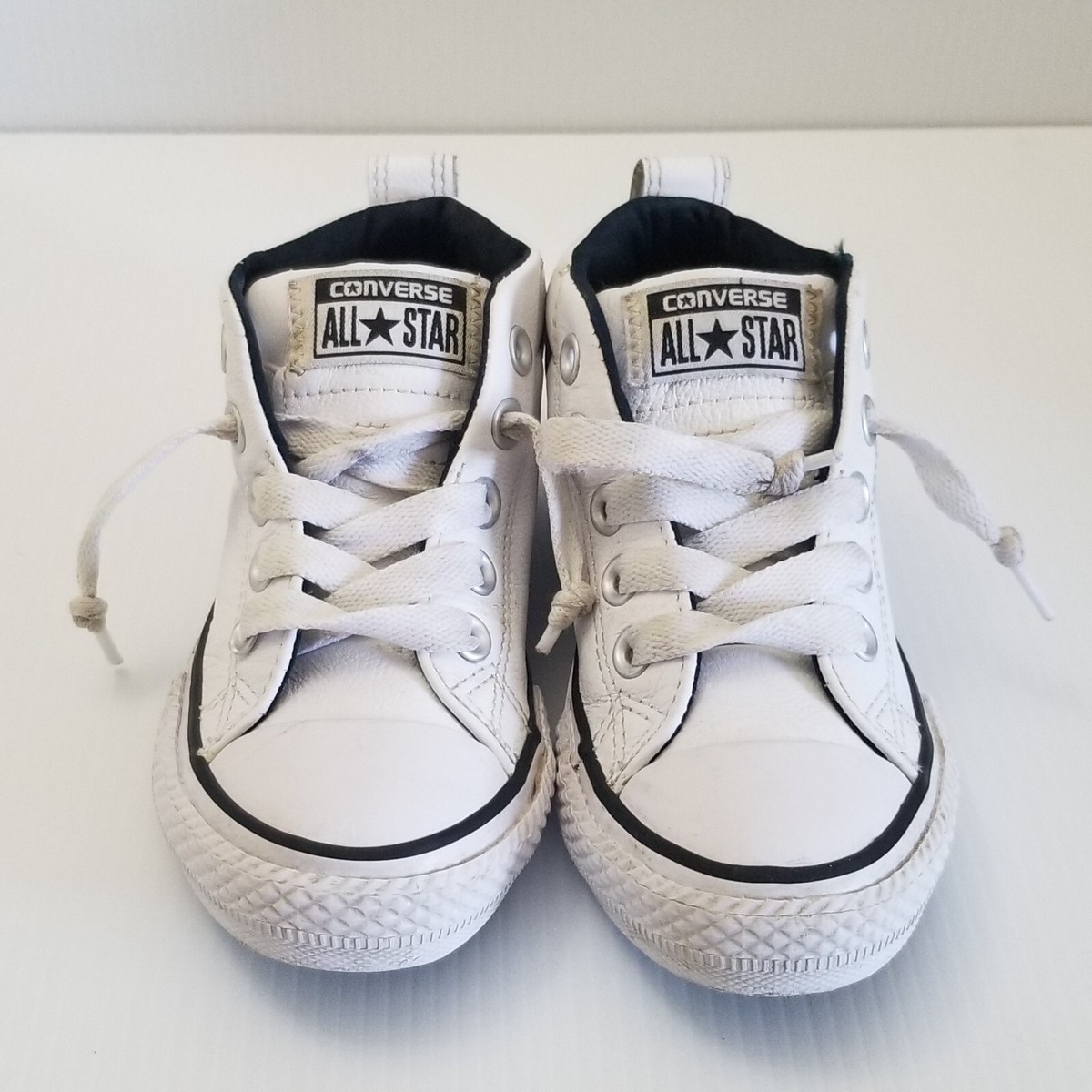 white leather converse high tops junior