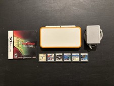 Konsola przenośna Nintendo „Nowa” 2DS XL biała pomarańczowa z ładowarką OEM i grami
