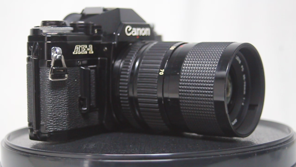 Canon AE-1 35mm SLR Film Camera + New FD 35-70mm F/4 Zoom Canon AE-1 35mm SLR Film Camera + New FD 35-70mm F/4 Zoom