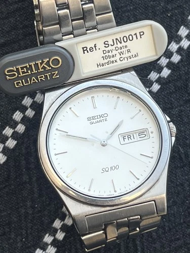 Seiko Mens SQ100 Day Date Silver White Vintage V743-8011 Quartz Stainless Steel