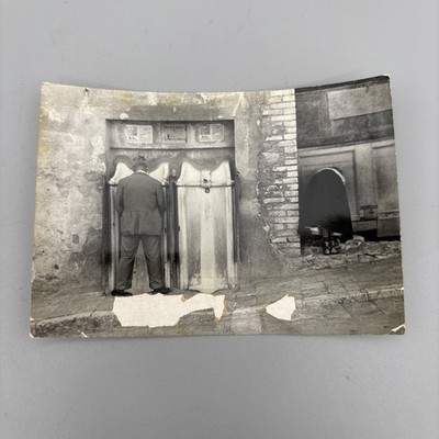 Mid 20th-C. Europe Photo of Man using public urinal, woman bending over VTG